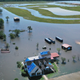 In this aerial view from a drone, a model home is surrounded by floodwaters from Hurricane Delta on October 10, 2020, in Iowa, Louisiana. Hurricane Delta made landfall as a Category 2 storm in Louisiana initially leaving hundreds of thousands of customers without power.